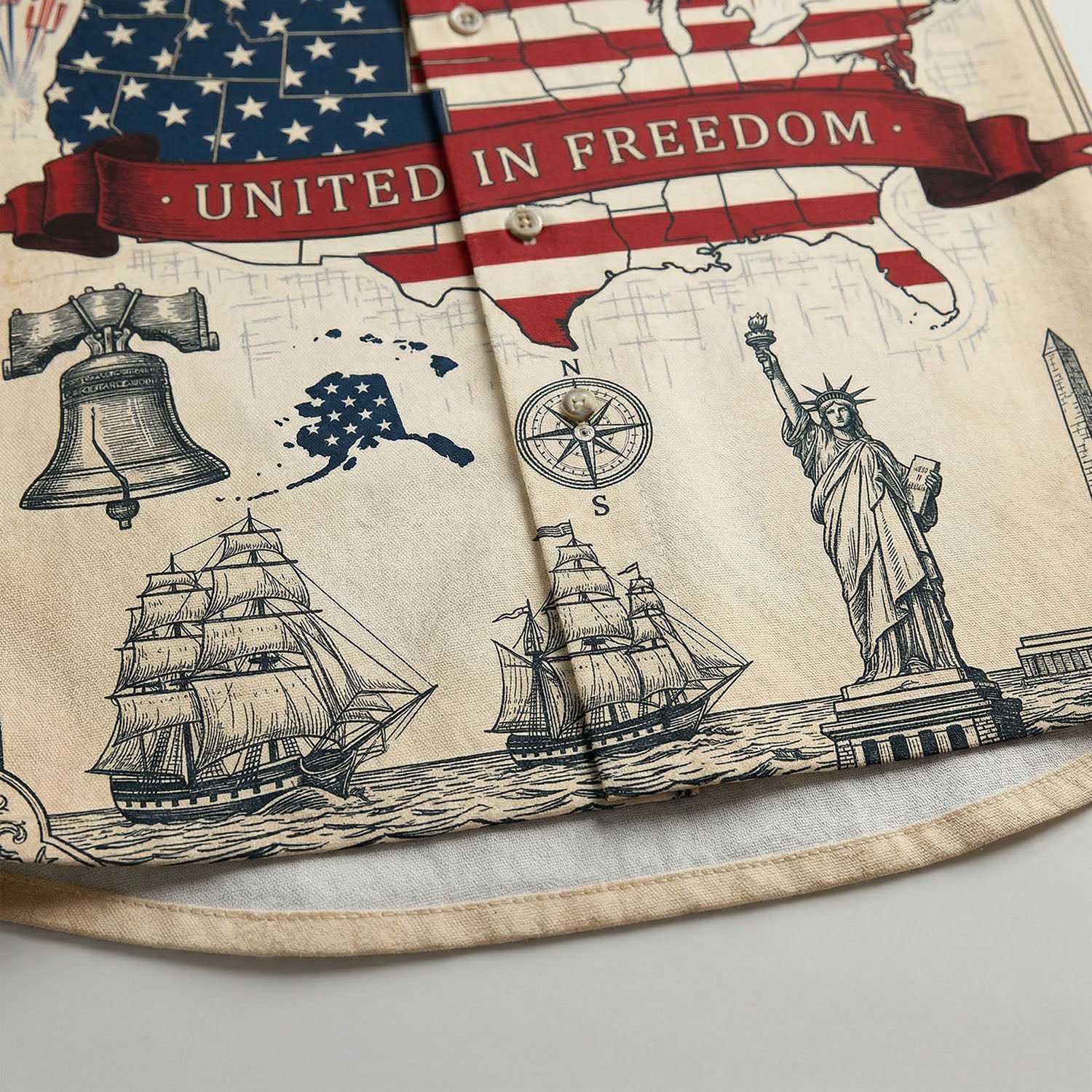Macro close up of the high quality print on the shirt featuring the Statue of Liberty Liberty Bell and United In Freedom red banner