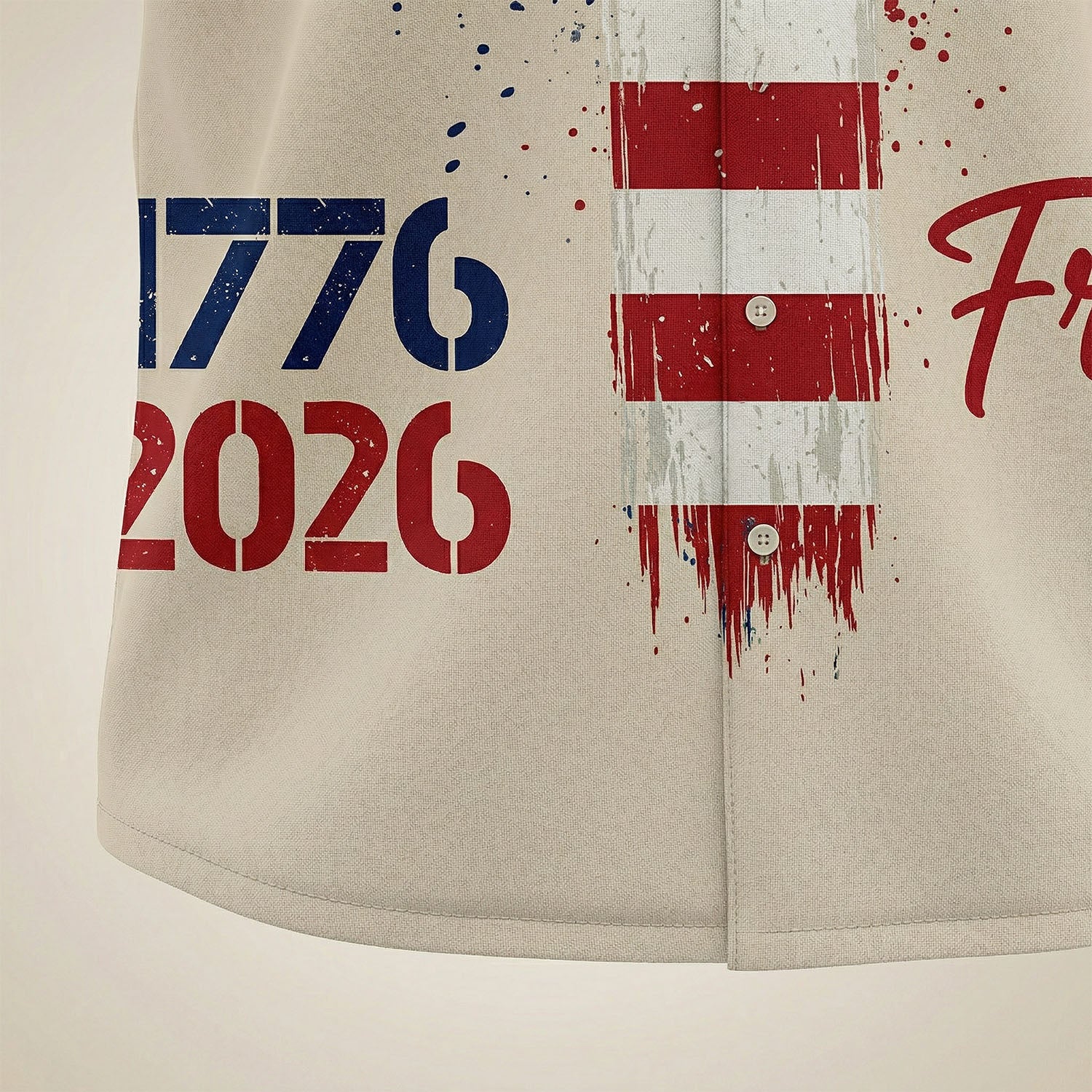 Macro shot of the high-quality print on the shirt hem showing "1776-2026" with brush-stroke flag details and clean stitching.