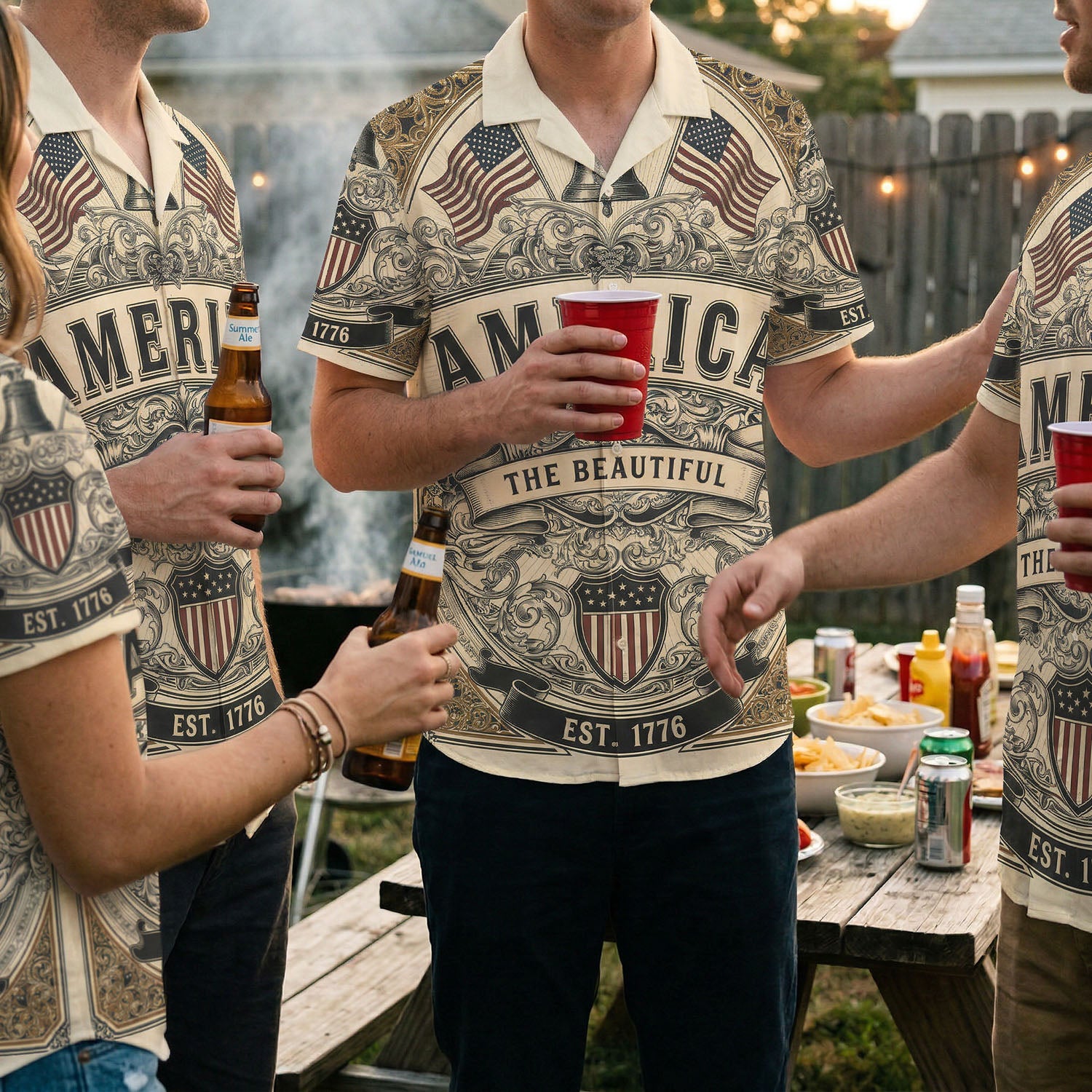 A group of friends wearing matching America The Beautiful patriotic shirts at a backyard BBQ celebration for the US 250th anniversary