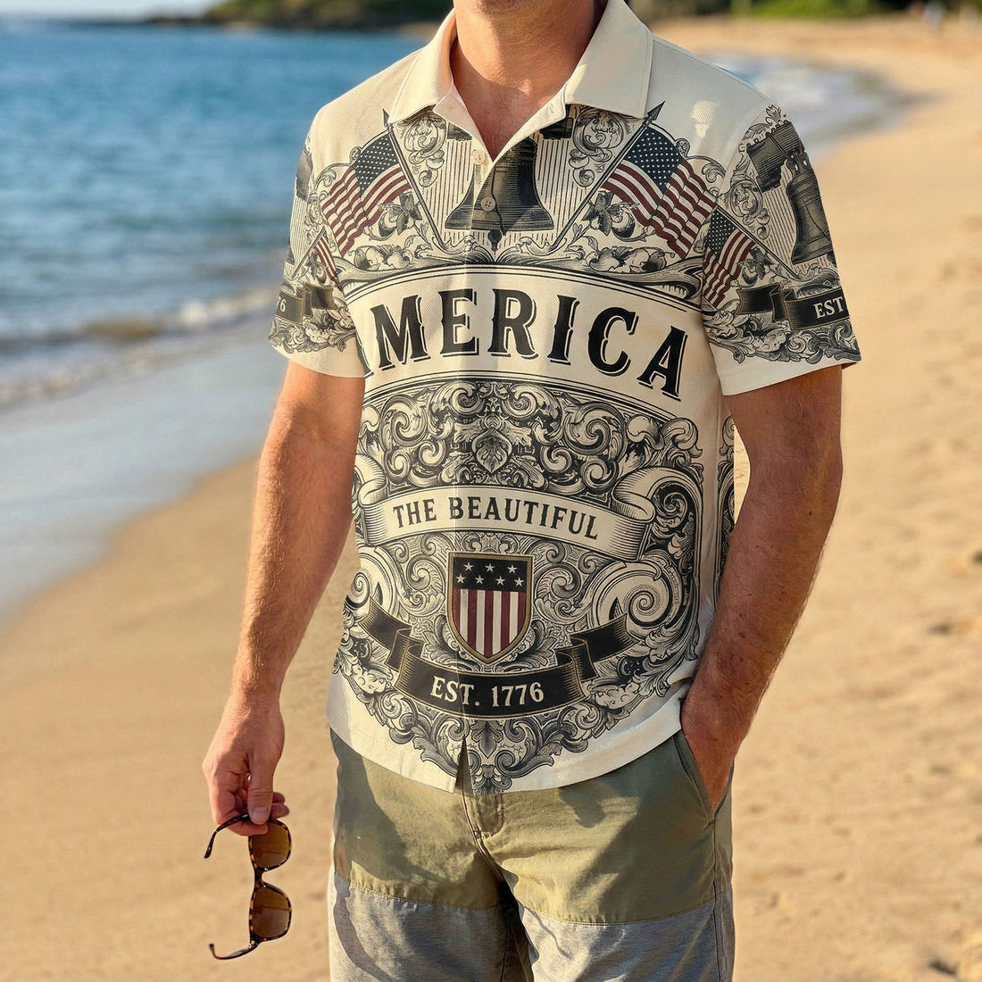 Front view of a vintage cream patriotic Hawaiian shirt featuring the Liberty Bell American flags and America The Beautiful text for the US 250th anniversary