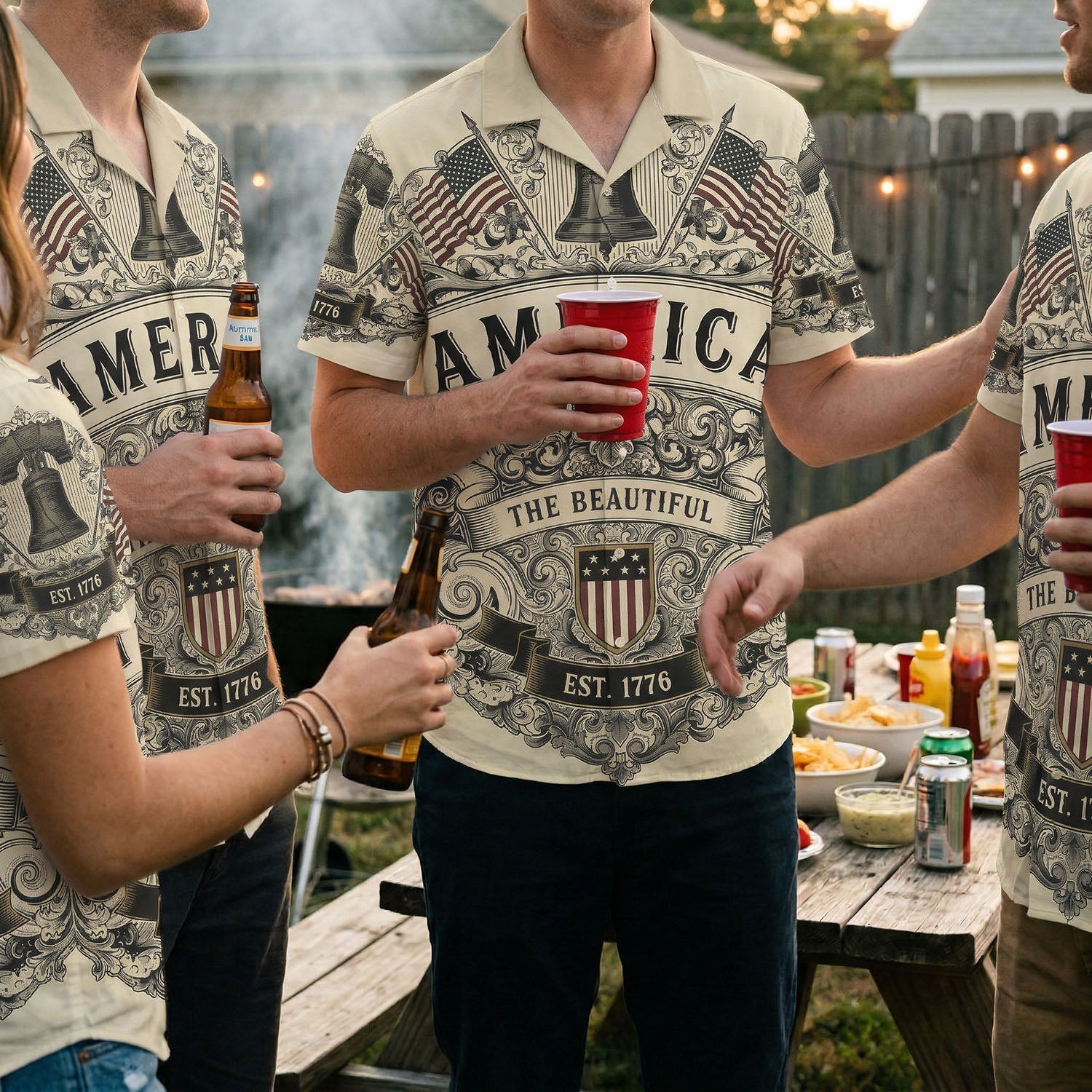 A group of friends wearing matching America The Beautiful patriotic shirts at a backyard barbecue celebration for the US 250th anniversary