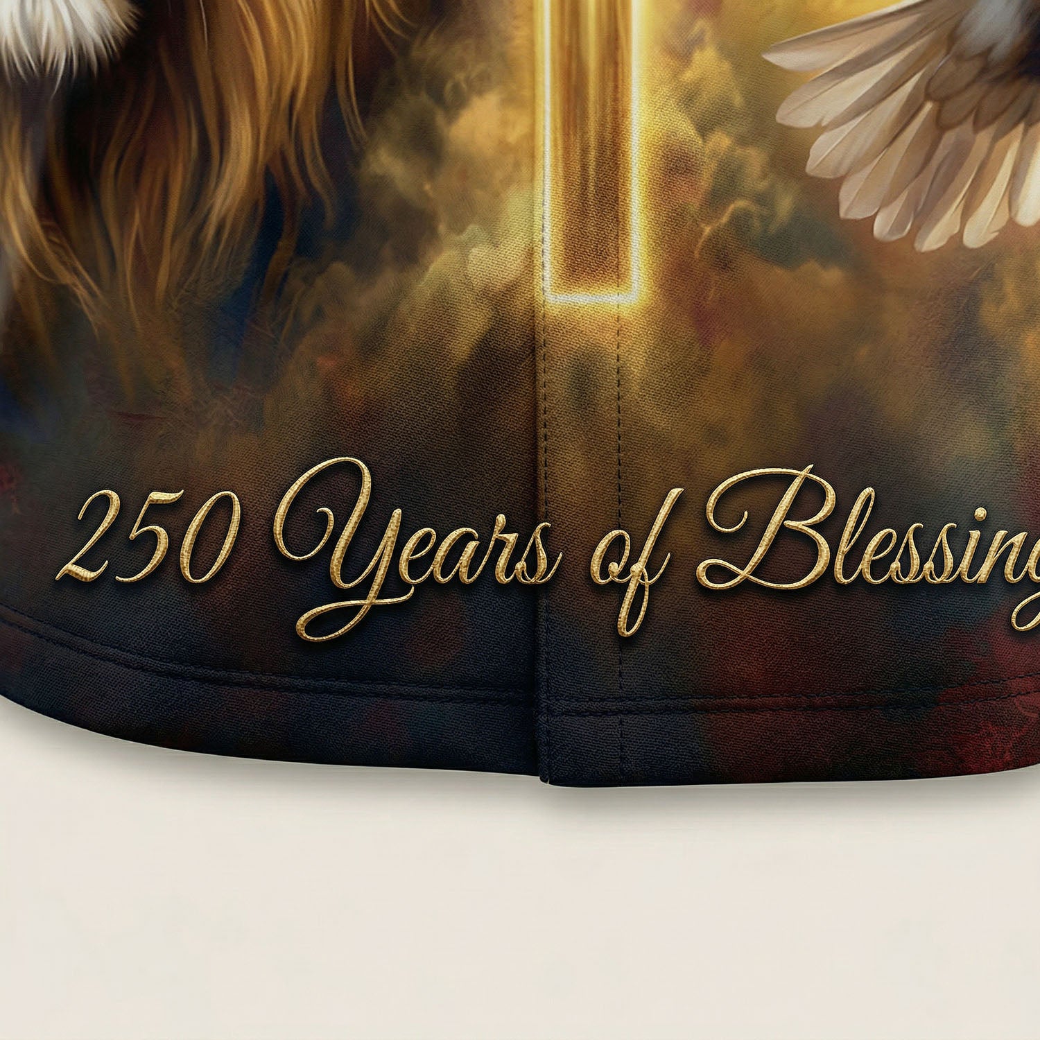 Macro close up of the premium fabric and high-definition gold-toned 3D print showing the 250 Years of Blessings text and texture.