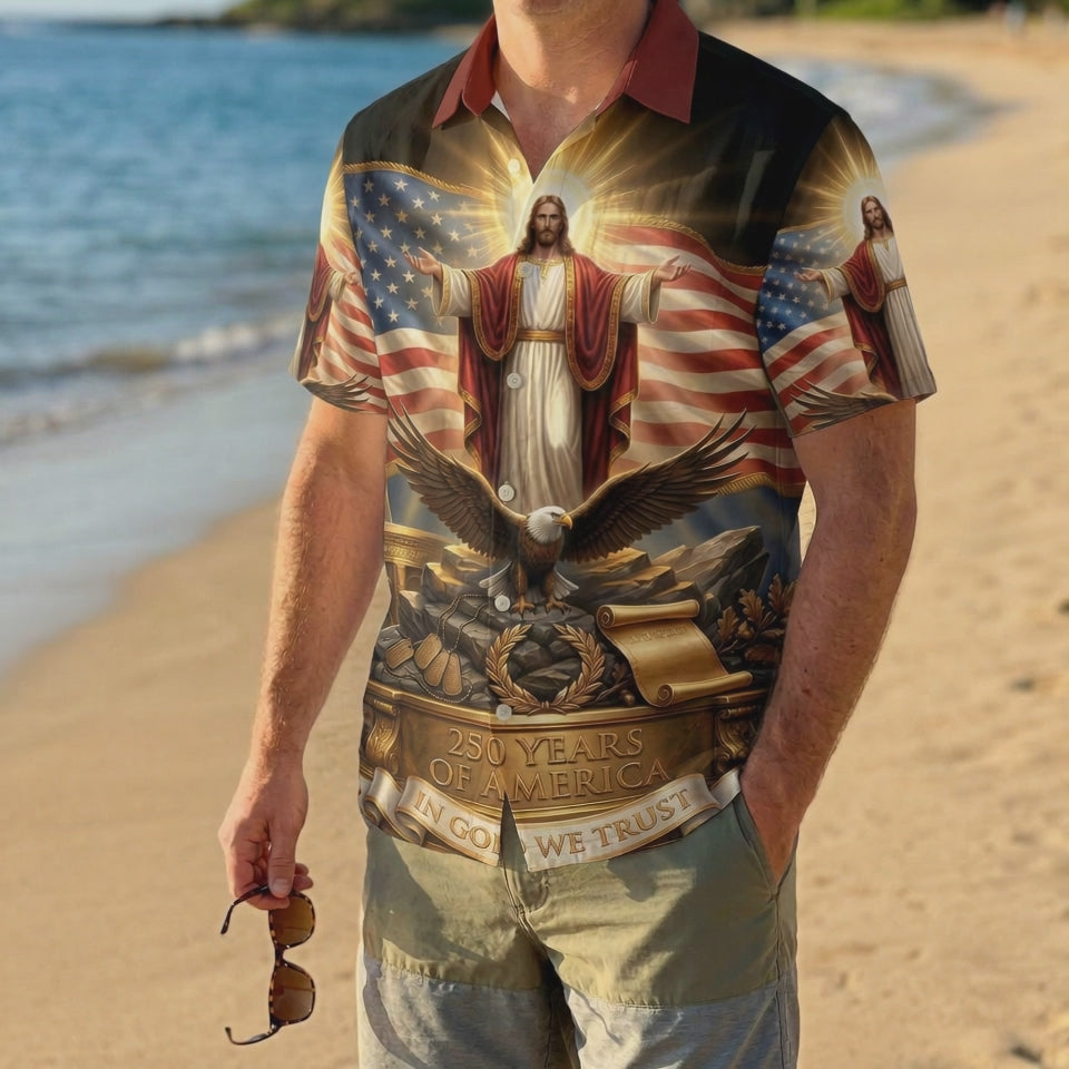 A male model wearing the vintage One Nation Under God Aloha shirt on a sunny beach, showcasing a meaningful and patriotic summer look.