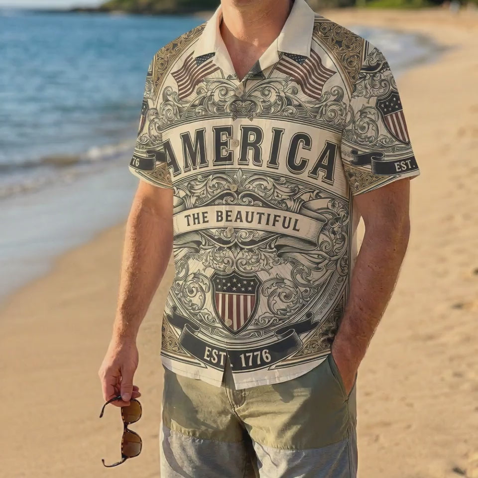 A male model wearing the vintage America The Beautiful Liberty Bell shirt on a sunny beach showcasing a casual patriotic summer outfit