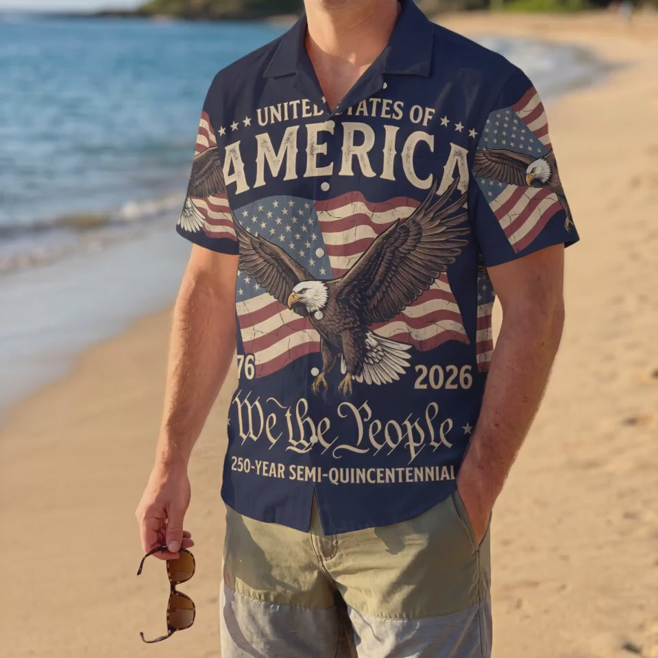 A male model wearing the vintage America The Beautiful Liberty Bell shirt on a sunny beach showcasing a classic American summer outfit