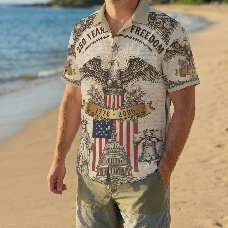 A male model wearing the 1776 2026 anniversary striped patriotic shirt on a sunny beach for a classic American summer look
