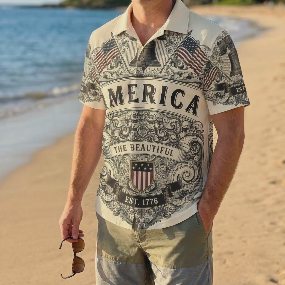 A male model wearing the vintage cream Liberty Bell patriotic shirt at a sunny beach showcasing a classic American summer look for the 250th anniversary