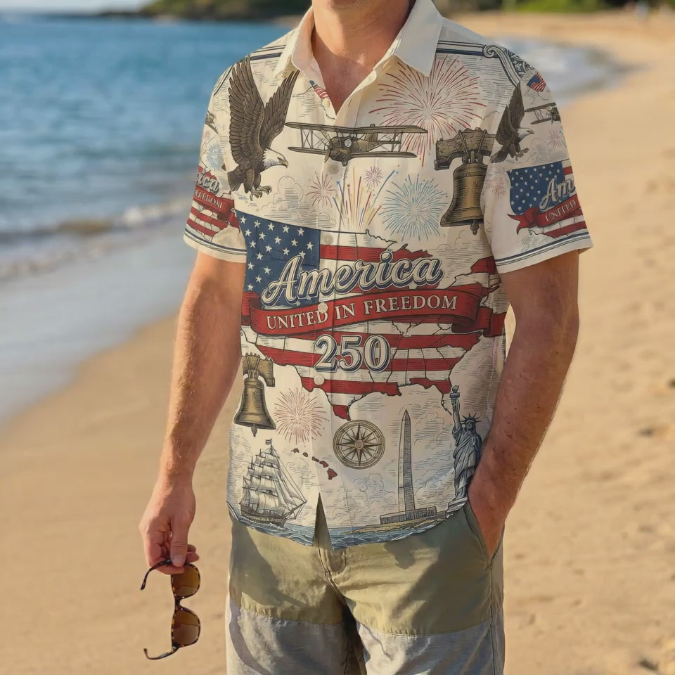 A male model wearing the vintage America The Beautiful Liberty Bell shirt on a sunny beach showcasing a classic American summer outfit