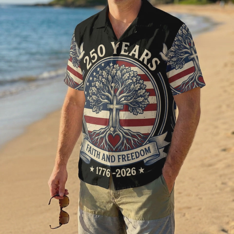 A male model wearing the black Faith and Freedom patriotic Hawaiian shirt on a beach, showcasing a relaxed summer holiday look.