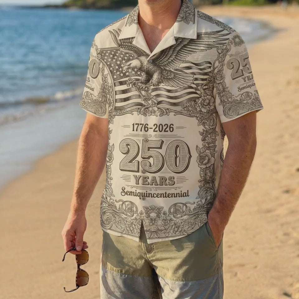 A male model wearing the vintage-style 1776-2026 American eagle shirt on a tropical beach, highlighting a casual and patriotic summer look video.